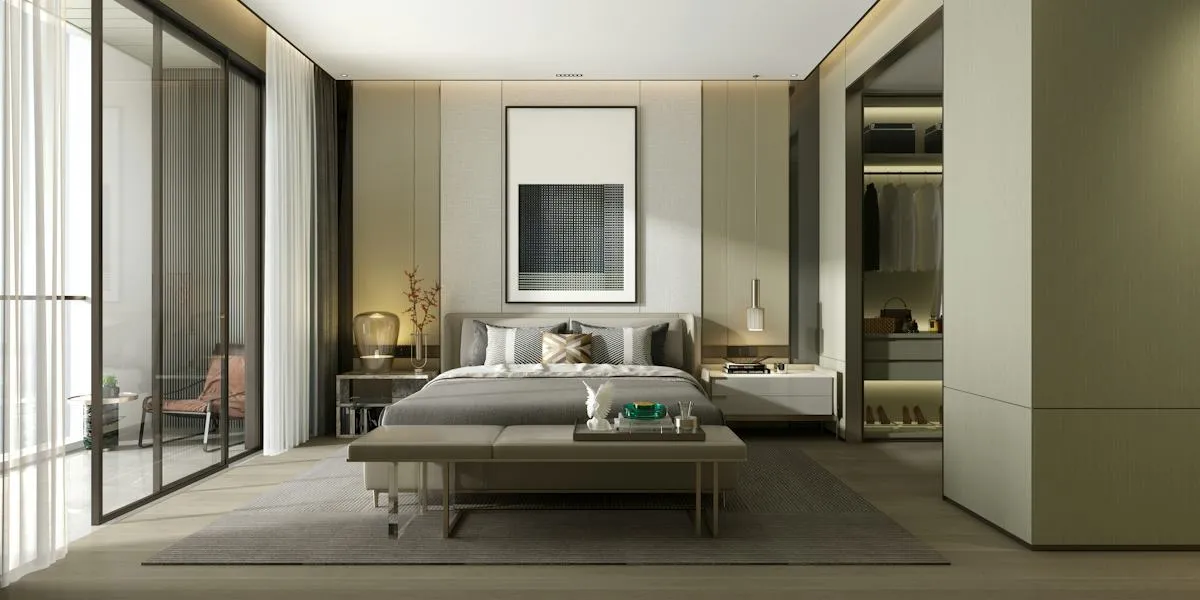 Minimal contemporary living room with pale furnishings and tall windows