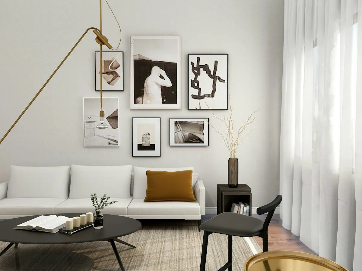 Neutral-toned living room with a gallery wall and pale sofa